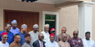 Governor Wike (5th from left in the front row) standing beside PDP Presidential Candidate, Atiku Abubakar (3rd right), with other PDP chieftains