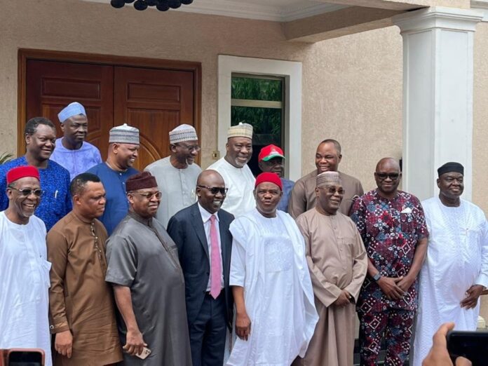 Governor Wike (5th from left in the front row) standing beside PDP Presidential Candidate, Atiku Abubakar (3rd right), with other PDP chieftains