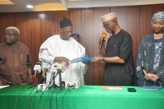 John Oyegun submitting report of APC presidential screening to Adamu Abdullahi