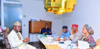 Kogi state governor and All Progressives Congress Presidential Aspirant, Yahaya Bello (L), explaining to the party's screening panel chaired by Chief John Odigie-Oyegun, how he stabilised the security situation in the state.