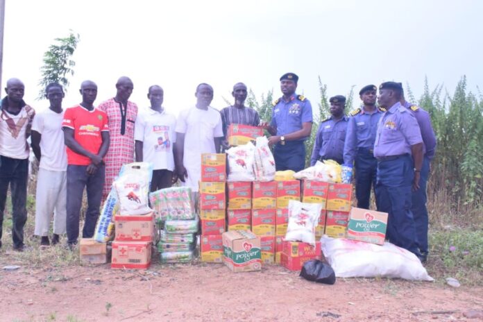 Commodore K I Odubanjo with the relief materials for the victims of flooding