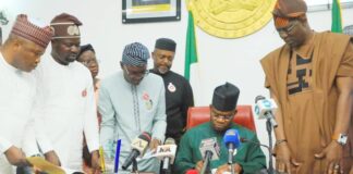 Governor Yahaya Bello signs the bill into law