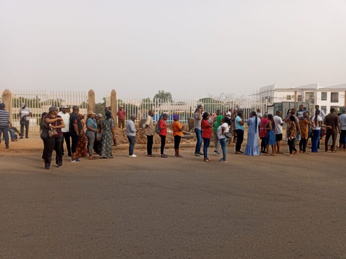Voters at the Wuye Police Station Polling Unit awaiting the arrival of INEC officials