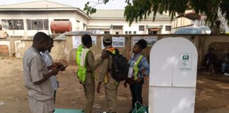 Corpers and INEC officials who just arrived the polling unit closed to Garki General Hospital