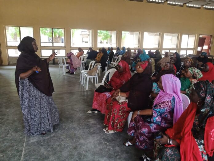 One of the facilitators talking to the participants