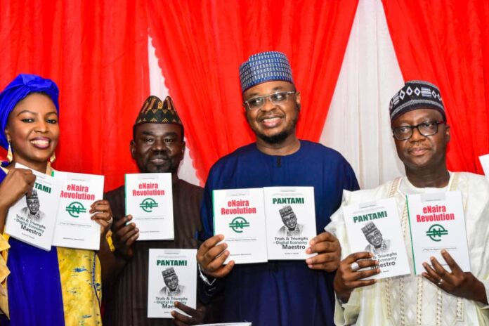 Minister of Communications and Digital Economy, Prof. Isa Aliyu Ibrahim Pantami (M), the publisher of PRNigeria, Economic Confidential and other beats, Mallam Yushau Shuaib with other dignitaries at the unveiling of the books