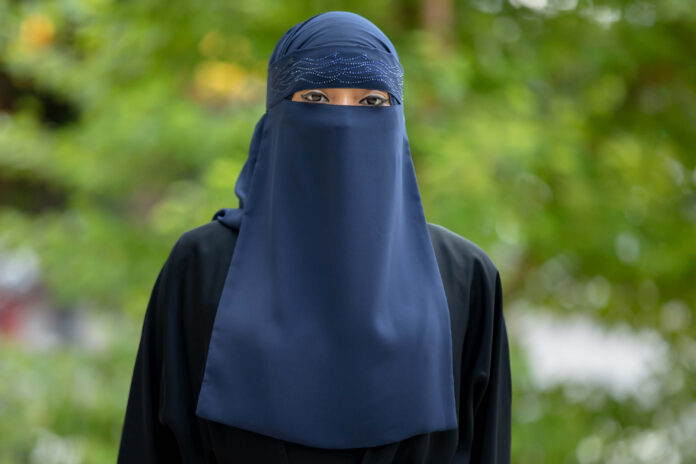 A lady wearing a niqab