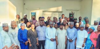 Members of APC with with Governor Yahaya Bello as he receives Haruna Ganaja