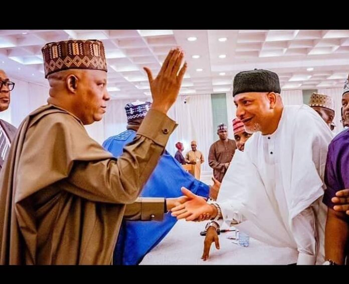 The Vice president, Kashim Shettima having a handshake with Senator Saliu Mustapha