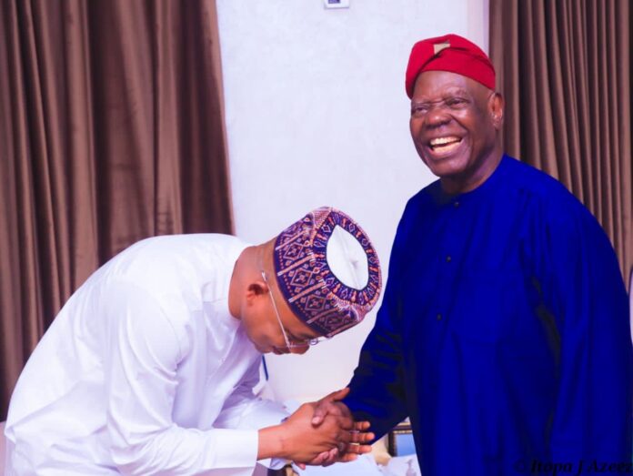 Chief Bisi Akande shaking hands with Ahmed Ododo Usman