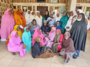 A Group Picture of the Hospital Attendants alongside Dr. Mairo Mandara, Dr. Mina Eudely, and Oluwaseyi Akinlaja (A midwife).