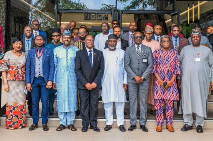 Group photograph with the Chairman CCC, Major General Chris Olukolade (Rtd), the Editor-in-Chief of IMPR, Alh. Yushau Shuaib