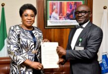 R-L: Mr Alfred Agaba Abah presenting his Letter of Appointment as SSAP to the Head of the Civil Service of the Federation, Mrs Didi Esther Walson-Jack, OON, mni.