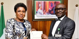 R-L: Mr Alfred Agaba Abah presenting his Letter of Appointment as SSAP to the Head of the Civil Service of the Federation, Mrs Didi Esther Walson-Jack, OON, mni.