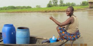 Woman riding a boat