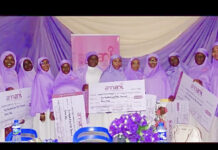 Amani coordinator, Mrs. Hadrat Omipidan with beneficiaries of the grants