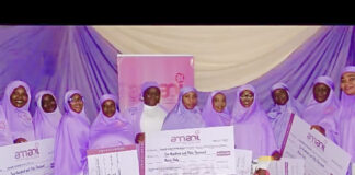 Amani coordinator, Mrs. Hadrat Omipidan with beneficiaries of the grants