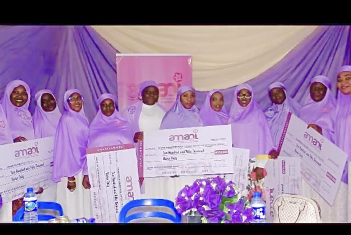 Amani coordinator, Mrs. Hadrat Omipidan with beneficiaries of the grants