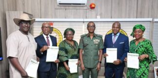Group photograph with the Director-General of NYSC, Brigadier General Olakunle Nafiu (M)