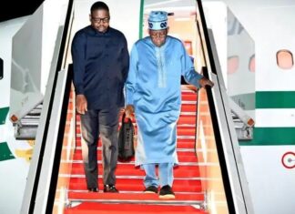 President Bola Tinubu with his spokesperson, Bayo Onanuga
