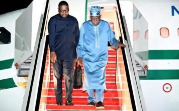 President Bola Tinubu with his spokesperson, Bayo Onanuga