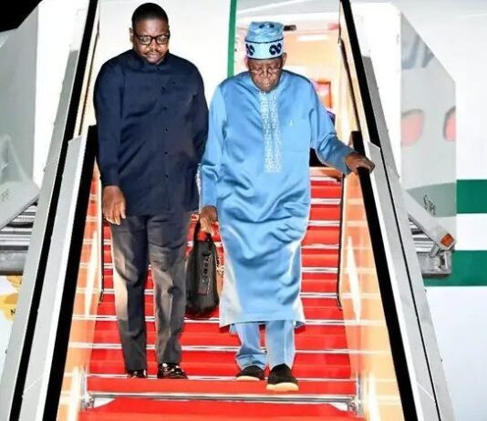 President Bola Tinubu with his spokesperson, Bayo Onanuga